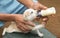 Feeding a newborn puppy from a bottle, puppy suck milk closeup