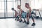 Feel it working in your core. three women working out with weights at the gym.