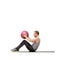 Feeling the burn of good exercise. A young man working out with a medicine ball on a white background.