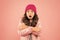 Feeling frosty. ready for cold winter. cold climate weather. frozen little girl pink background. kid puffer jacket and