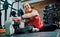 Feeling good. Full length shot of an attractive young female athlete stretching before starting her workout in the gym.