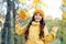 Feeling great. girl in yellow knitted sweater and hat. kid enjoy nature in autumn park. fall is a time for fun. fall