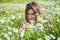 Feeling happiness. medical herb. health care concept. beautiful woman in chamomile flower field. summer or spring nature