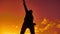 Feeling like a winner Silhouette hand up of man pumping his fist in the air. man victory businessman concept lifestyle