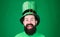 Feeling lucky. Happy irish man with beard smiling in green wear. Happy saint patricks day. Bearded man celebrating saint