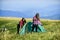 Feeling playful. friends spend free time together. family camping. reach destination place. two girls pitch tent
