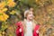 Feeling protected at this autumn day. Happy childhood. Small child with autumn leaves. Happy little girl in autumn