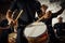 Feeling the rhythm in the drums. Closeup shot of a musical performer playing drums with his band.