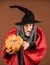 feeling scared. 31 october. gothic man in Halloween costume. senior man hold pumpkin. old man in magic hat and cloak