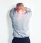 Feeling the strain of a stressful day. Studio shot of a mature man experiencing neck ache against a white background.