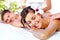 Feeling the stress melt away. Attractive young couple enjoying a massage at the spa.