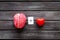 Feelings and mind concept with brain plus heart on wooden background top view