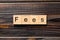 Fees word written on wood block. Fees text on wooden table for your desing, Top view concept