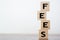 Fees word written on wooden cubes