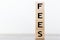 Fees word written on wooden cubes