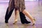 Feet of Argentinian tango dancers on a dancing parquet