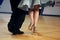 Feet of Argentinian tango dancers on a dancing parquet