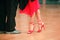 Feet of Argentinian tango dancers on a dancing parquet