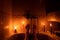 Feet in the bathroom without light by candlelight in a dark apartment in Ukraine, Ukraine without electricity due to the