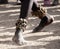 Feet of a black teenager dancing on the sand folk ritual dance