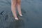 Feet Buried in Sand at Beach