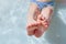 feet of a child - a boy lying in an inflatable children`s pool, in the water, swims on a warm day