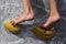 Feet of a child climbing on a mobile climbing wall