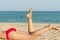 Feet Closeup Of Young Girl On Holiday Relaxing On Beach