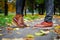 Feet of a couple in love in brown shoes