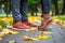 Feet of a couple in love in brown shoes