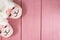 Feet female wearing cute sleeping pink llama trendy slippers soft pastel colours pink on wooden background Top view Soft