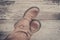 Feet. First-Person view on rustic wood background.