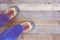 Feet. First-Person view on rustic wood background.