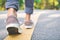 Feet of girl walking in the road