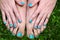 Feet and hands with creative teens manicure