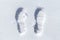 Feet imprint in fresh white snow