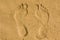 Feet imprint in sand