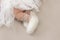 Feet of a newborn girl, little ballerina in fluffy points, dancer tired, tutu skirt, newborn