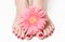 Feet with pink manicure and flower