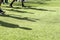 The feet of the players of Paok with their shadows during team p