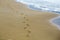 Feet prints on sea beach