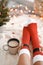 Feet in Santa`s socks near the Christmas tree