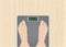 Feet on scales, Wooden desk background, woman feet on overweight scales