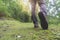 Feet in shoes on a forest path,