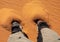 Feet are sinking in the sand of the namib desert in Namibia