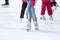 Feet skating on the ice rink