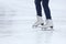 Feet skating on the ice rink