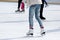 Feet skating on the ice rink