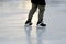 Feet skating person at the rink