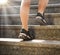 Feet in sneakers going up the stairs